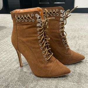 Pointy lace up stiletto bootie.